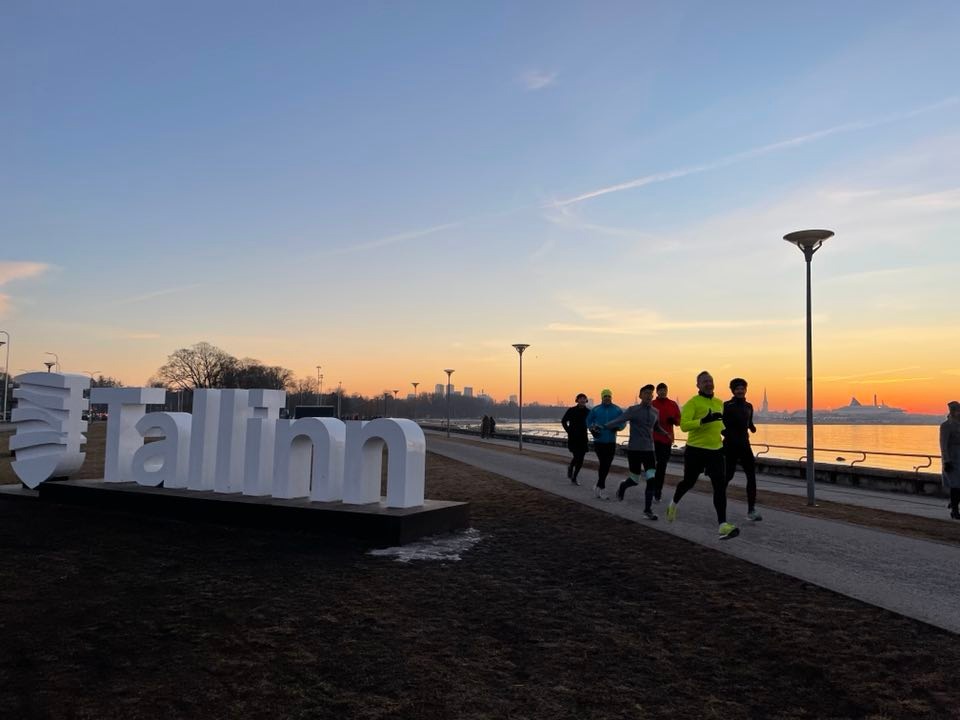 Running past the Tallinn city sign.